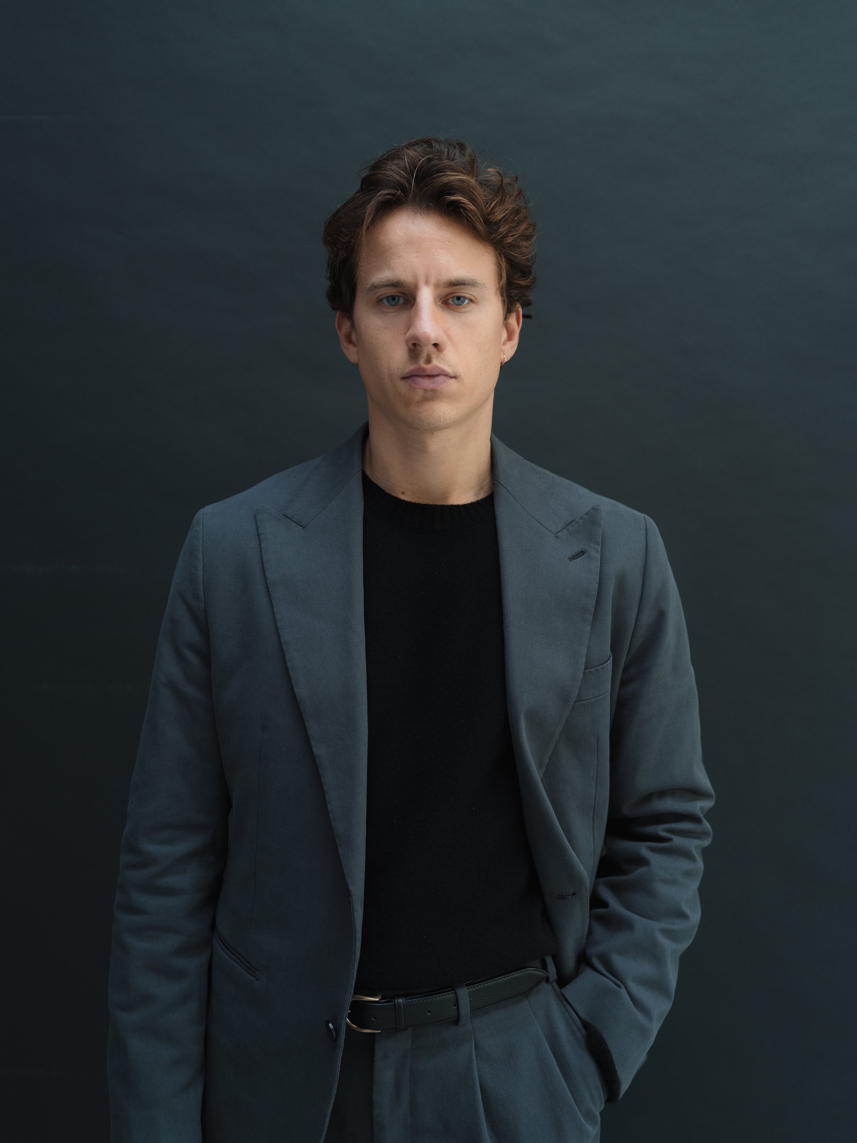 Custom-made suits in rich textures and shades, crafted with precision at Atelier ACÀN in Antwerp and Ghent.
