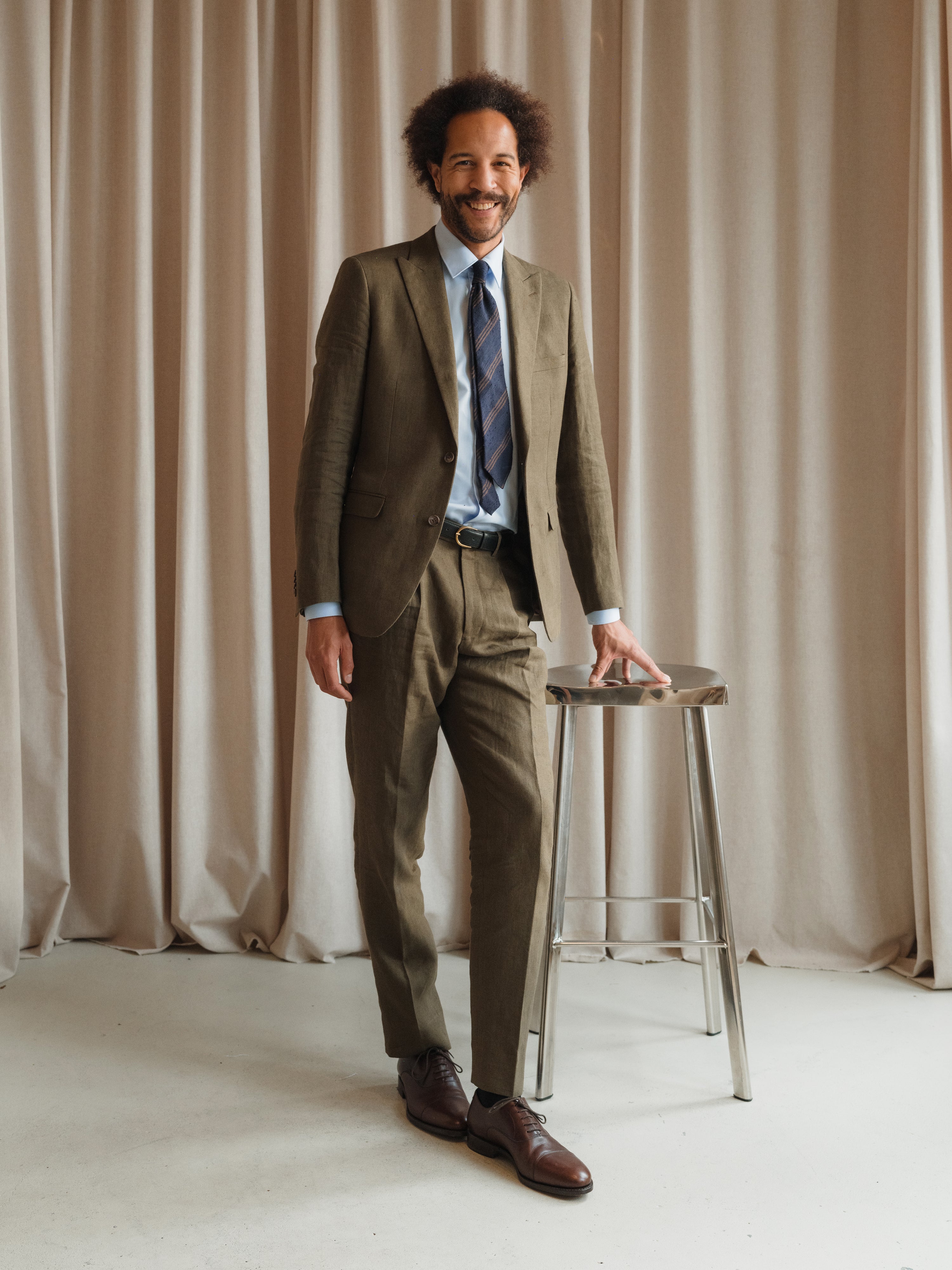 Luxury suits in an array of styles, from refined solids to subtle and bold patterns, at Atelier ACÀN in Ghent and Antwerp.