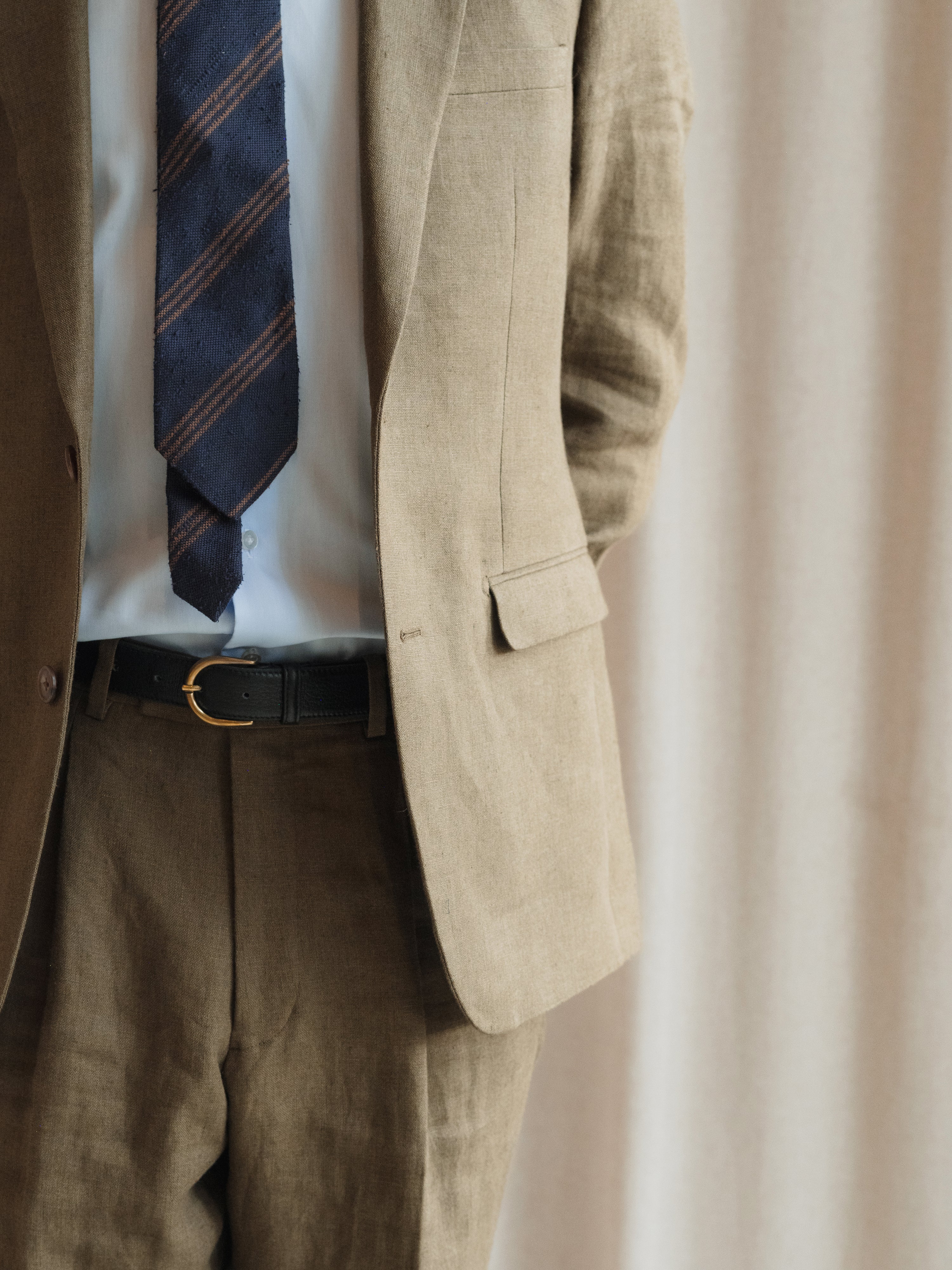 A showcase of tailored menswear, highlighting expert craftsmanship and diverse styling options.
