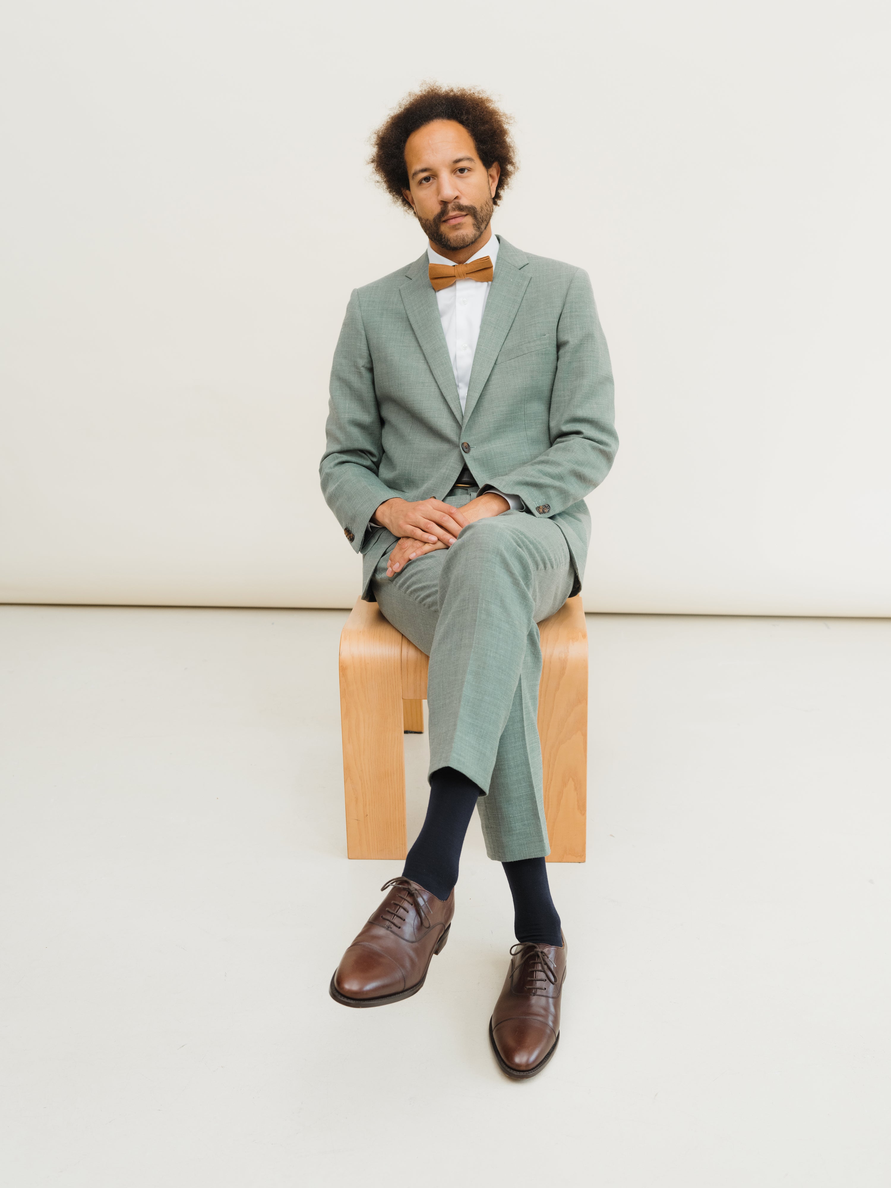 A showcase of tailored menswear, highlighting expert craftsmanship and diverse styling options.
