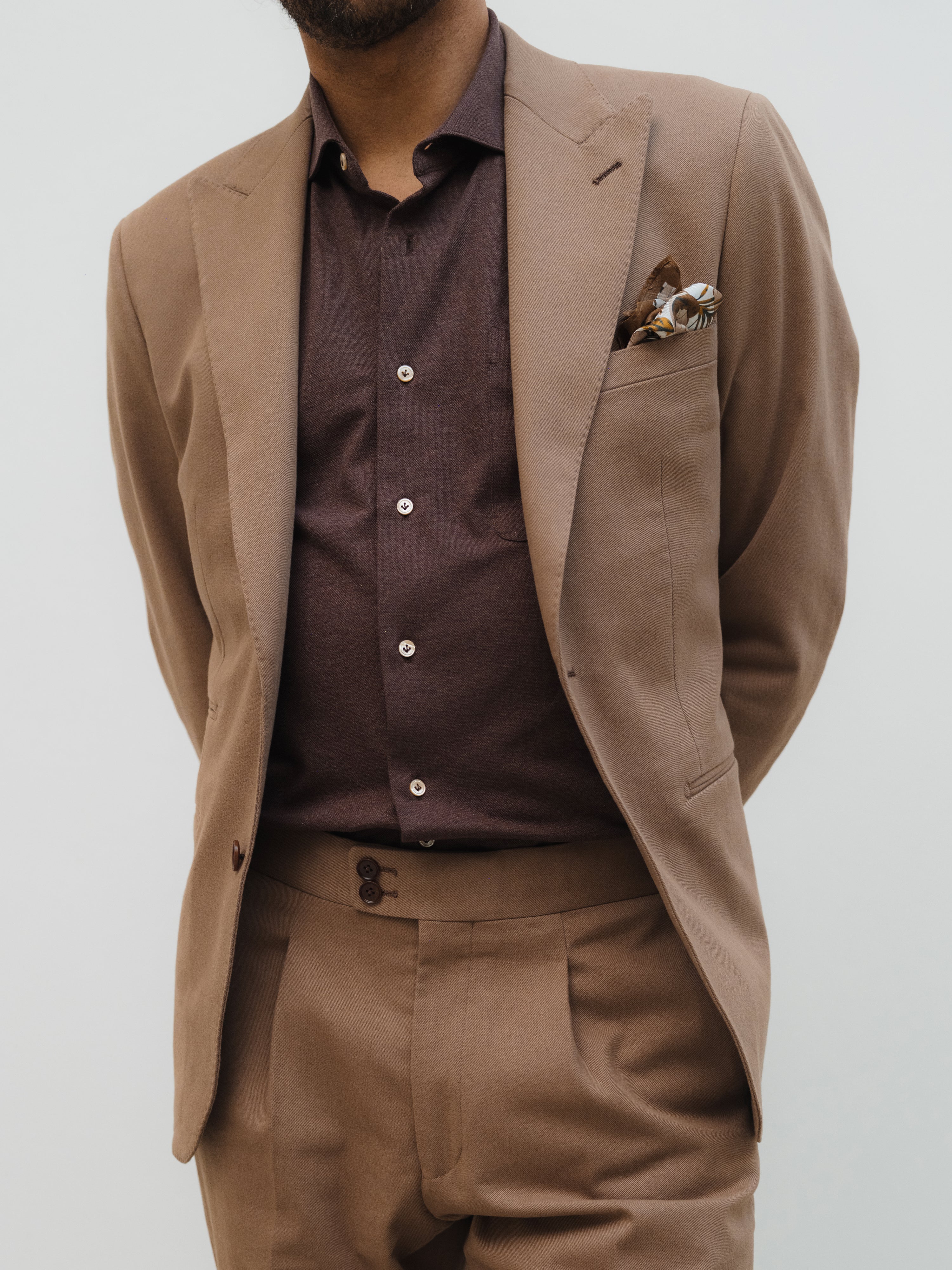 Men's bespoke brown suit by Atelier ACÀN featuring classic cut and modern fit