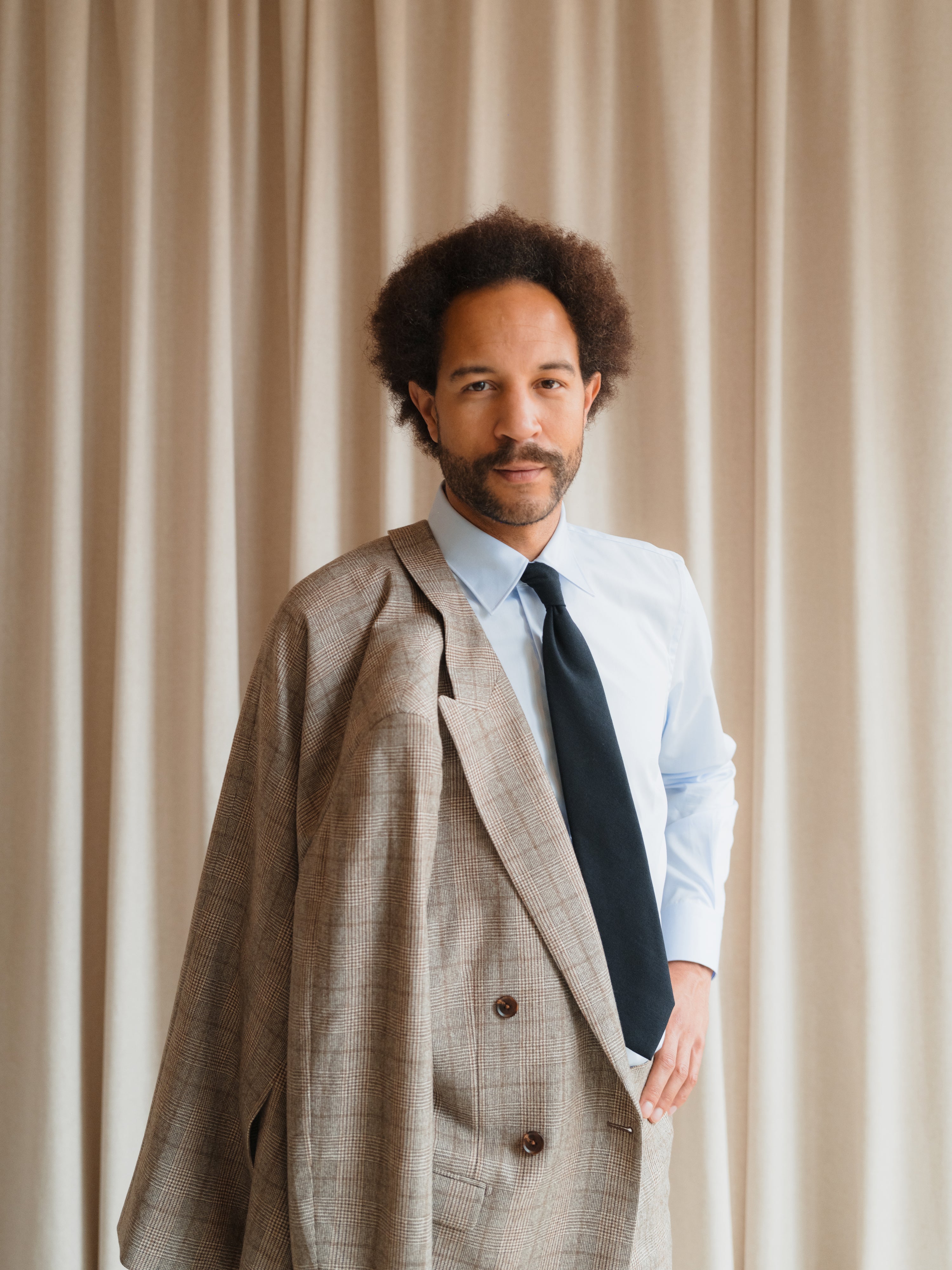 Tailored suits in a variety of colors and patterns, designed for business, weddings, and formal occasions.