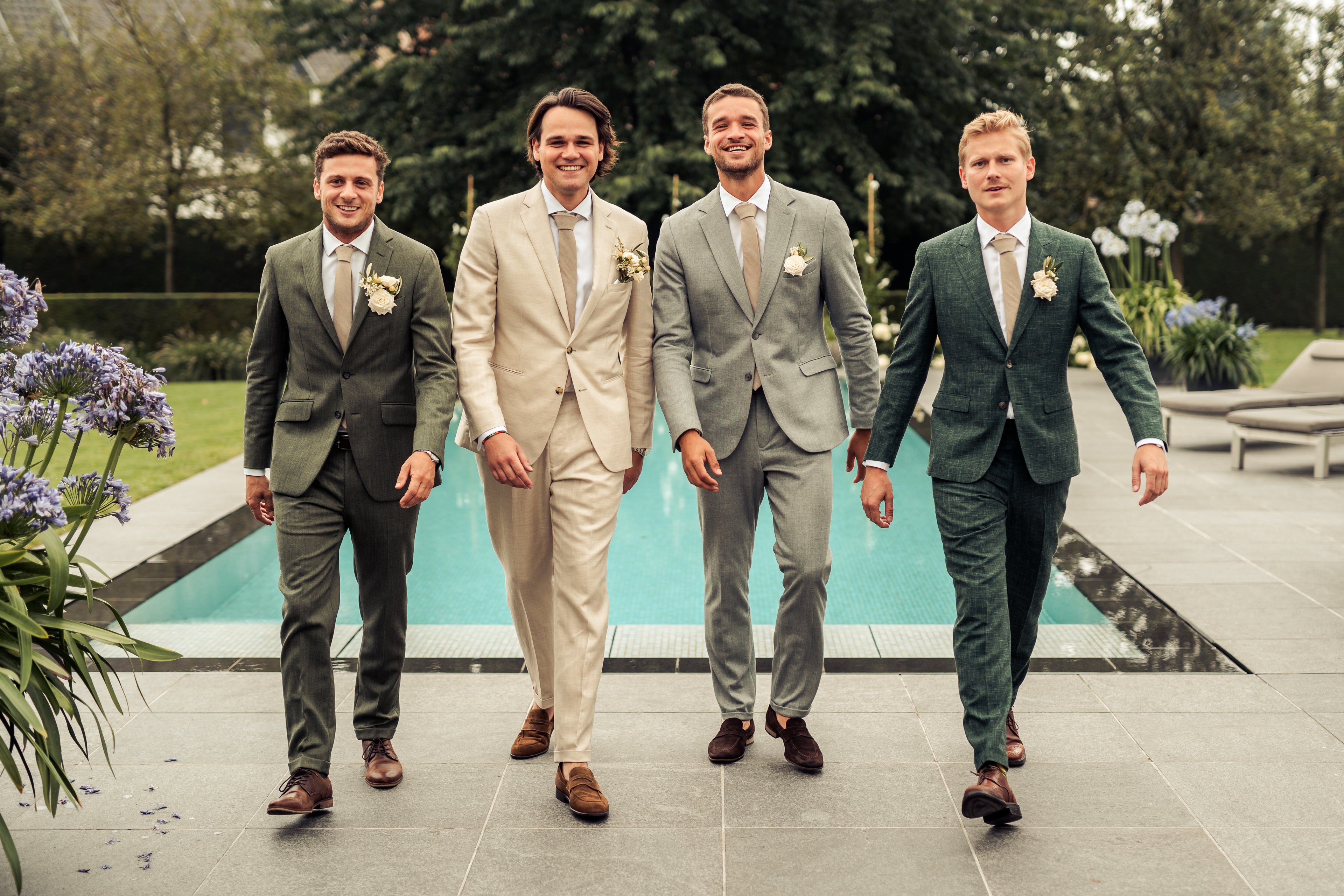 Elegant groomsmen in coordinated custom suits by Atelier ACÀN, perfect for a refined wedding aesthetic.