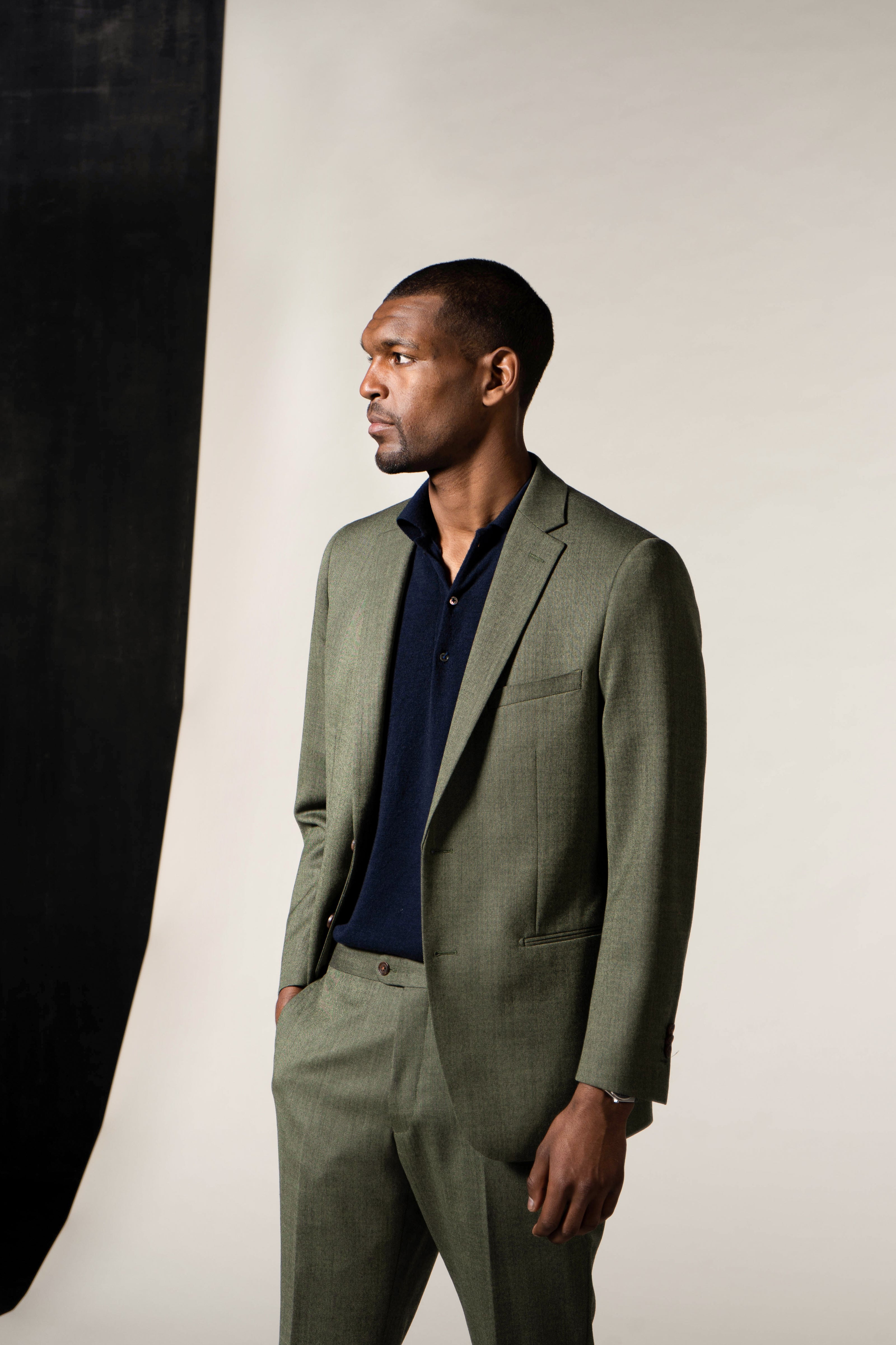 Bespoke suits in a variety of colors and styles, tailored by Atelier ACÀN in Antwerp and Ghent.