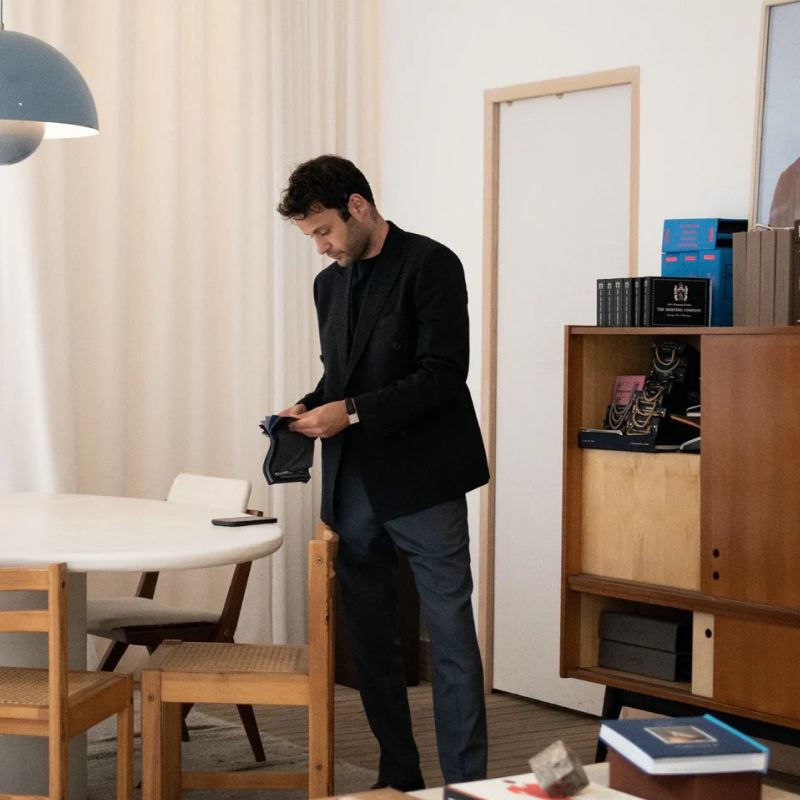 Atelier ACÀN’s expert tailor handcrafting a custom suit in our Antwerp studio.