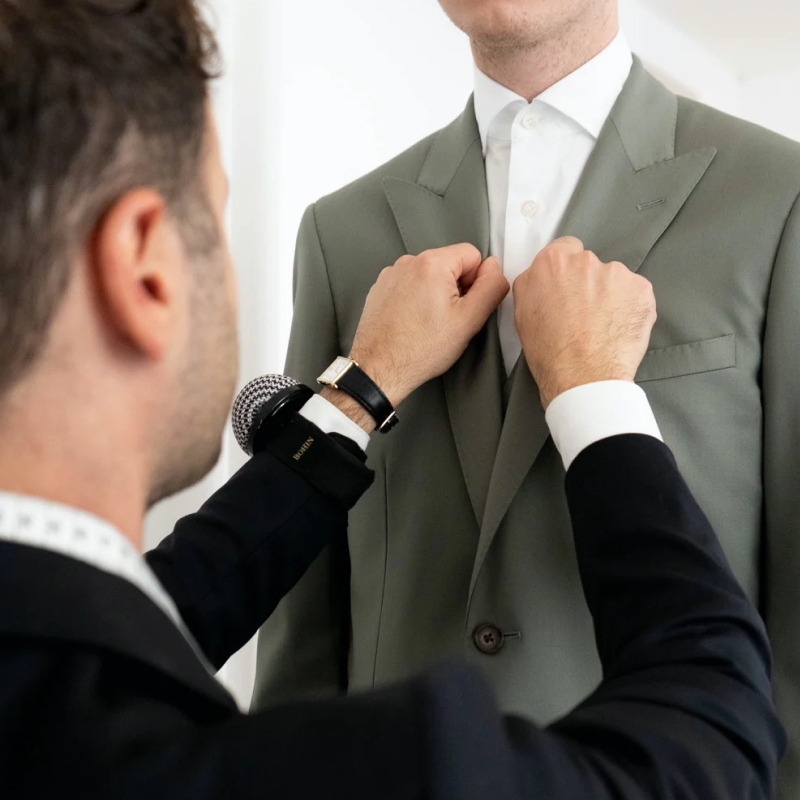 Atelier ACÀN’s expert tailor handcrafting a custom suit in our Antwerp studio.